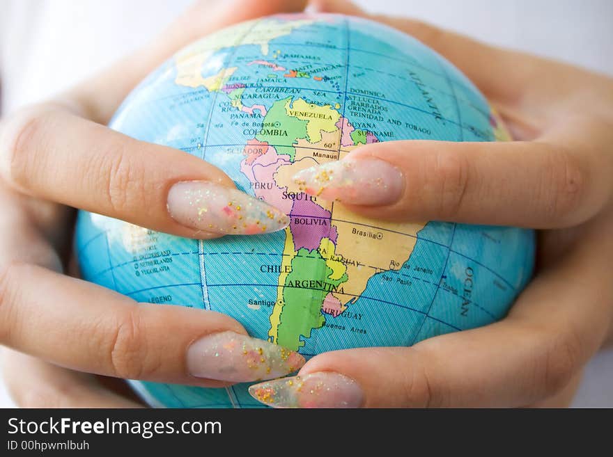 Girl holding globe in hands