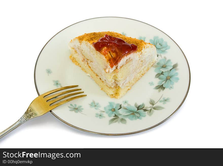 Cake on plate and fork, isolated on white background