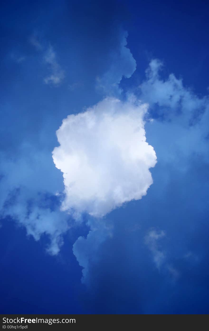 Abstract of deep blue sky with white fluffy cloud