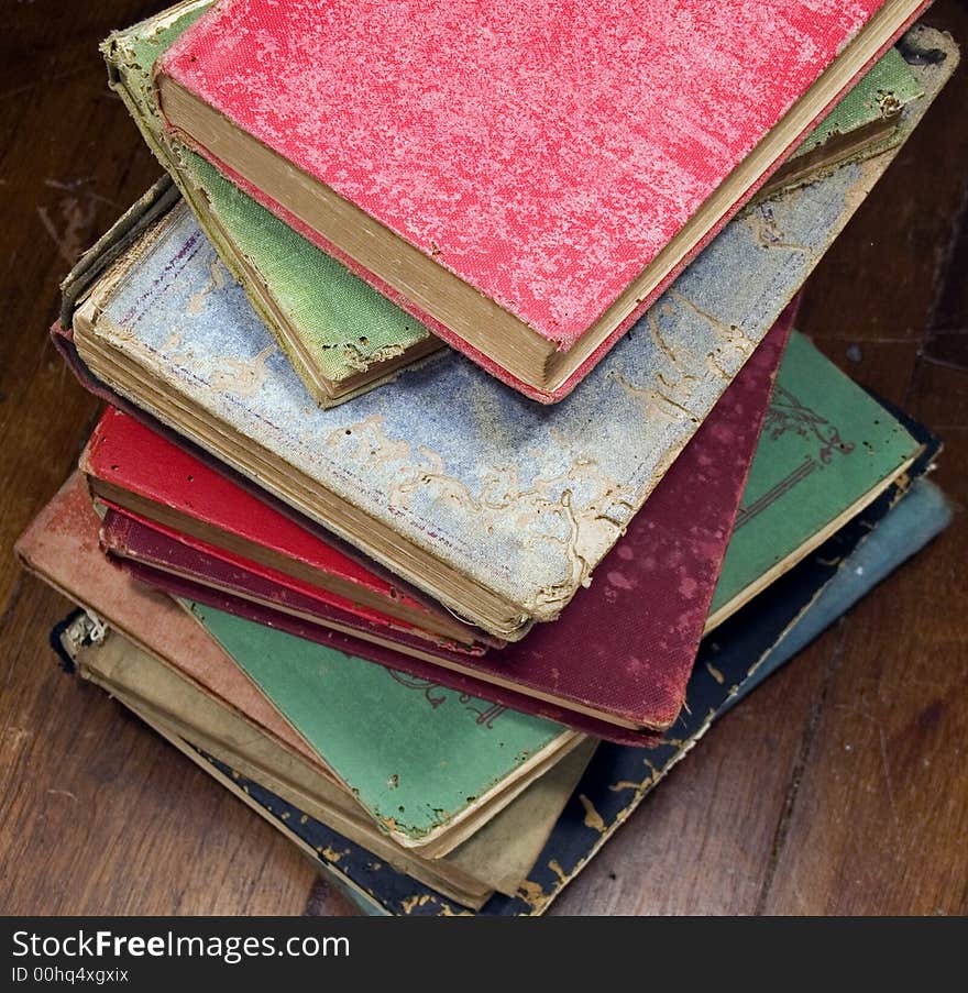 a pile of old books on the floor