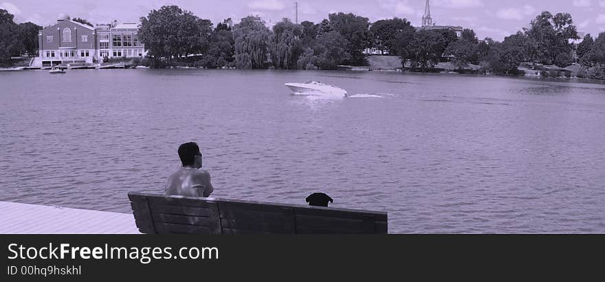 Man and his dog watching boat