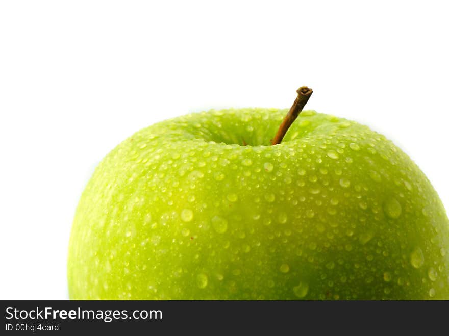 Big green apple covered  drop of water on  white background