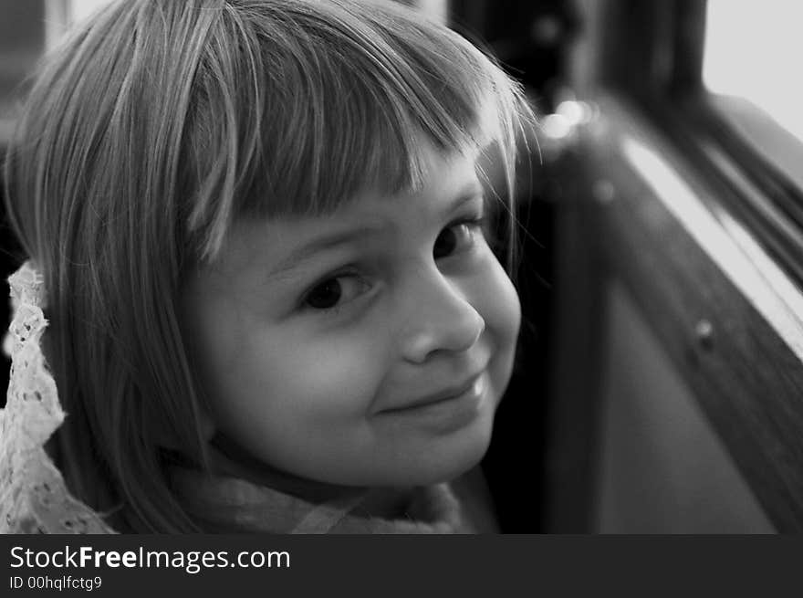 Smiling kid lighted from a bus window