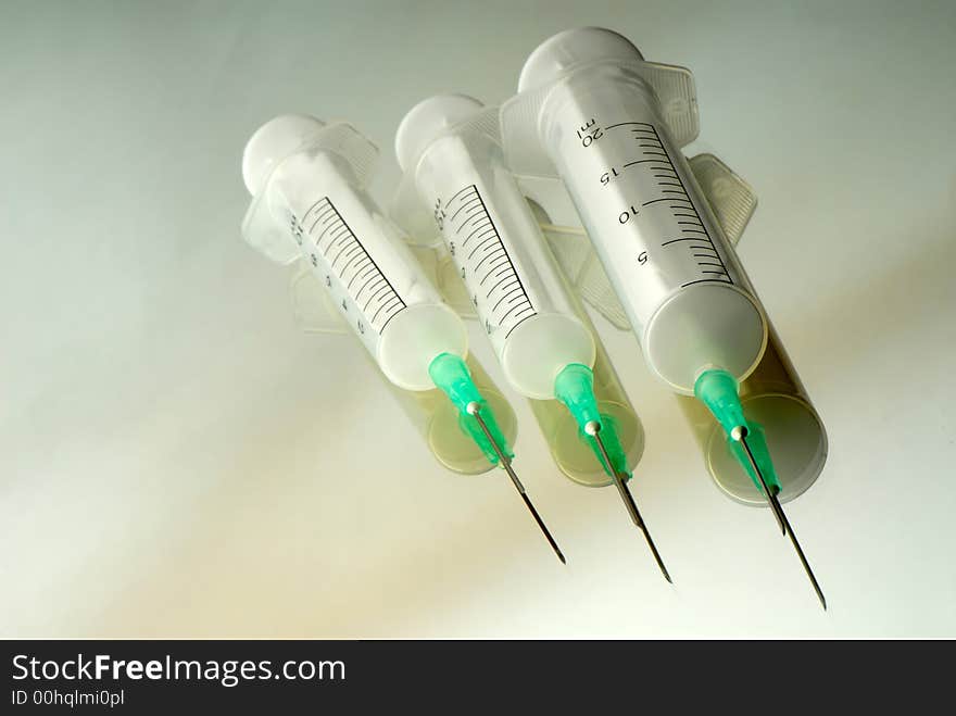 Three disposable syringes are isolated on  white background. Three disposable syringes are isolated on  white background