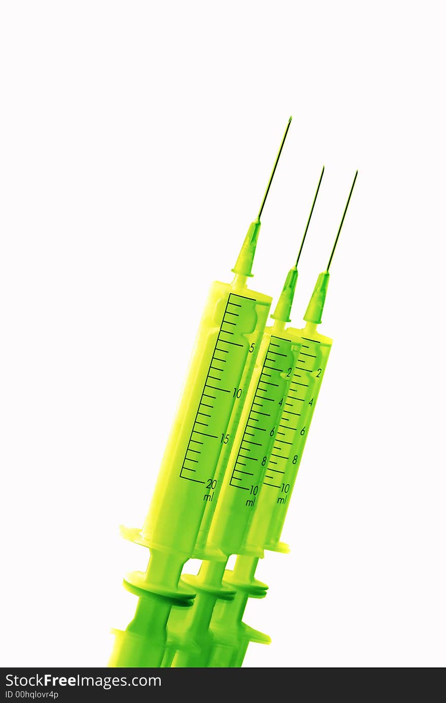 Three disposable syringes green color are isolated on white background. Three disposable syringes green color are isolated on white background