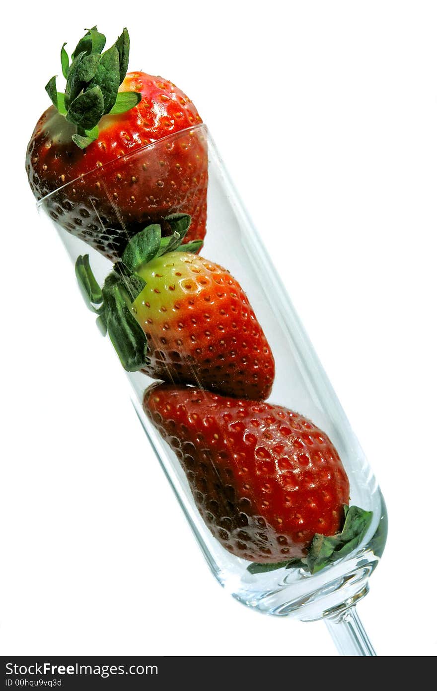 Composition made with Champagne glass full of strawberries. Composition made with Champagne glass full of strawberries