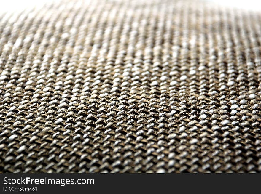 A brown grey texture from a pillow. A brown grey texture from a pillow