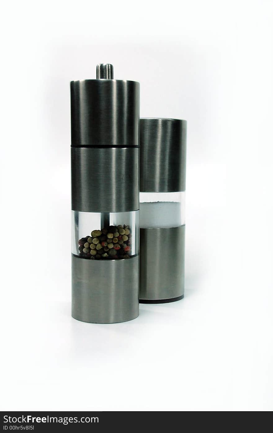 A modern metal pepper and salt shaker. A modern metal pepper and salt shaker