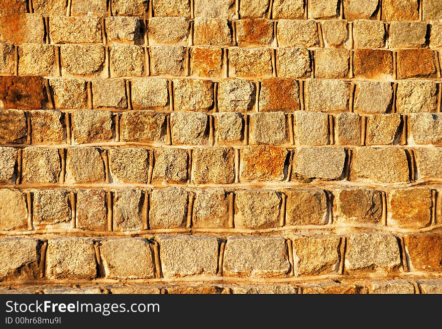 A yellow stone background, a wall. A yellow stone background, a wall.