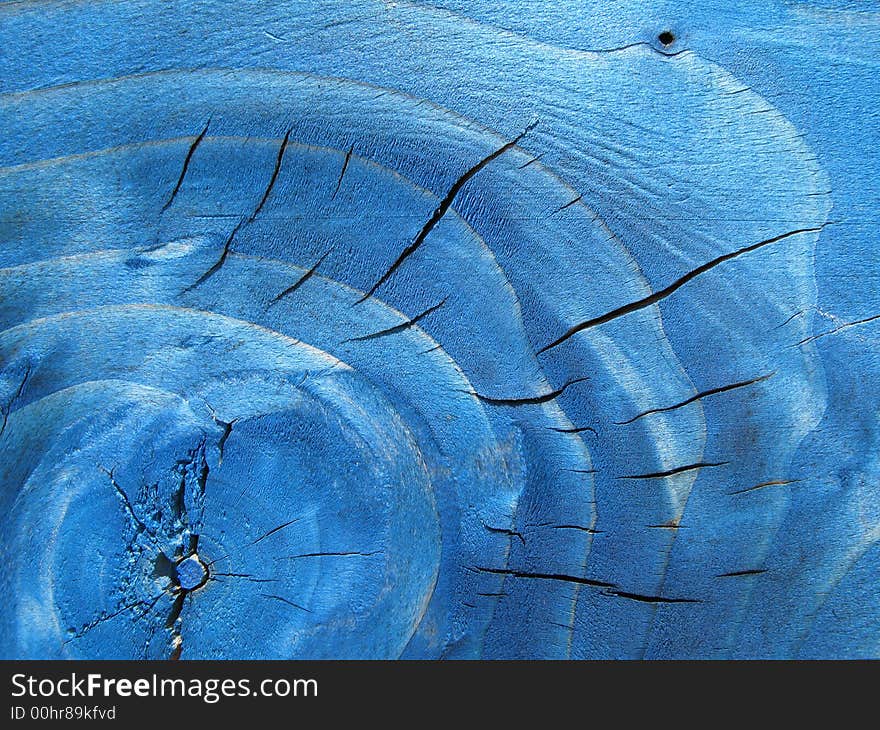 A big knot from a blue wood board. A big knot from a blue wood board