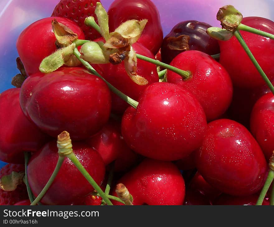 Red cherries over a dish