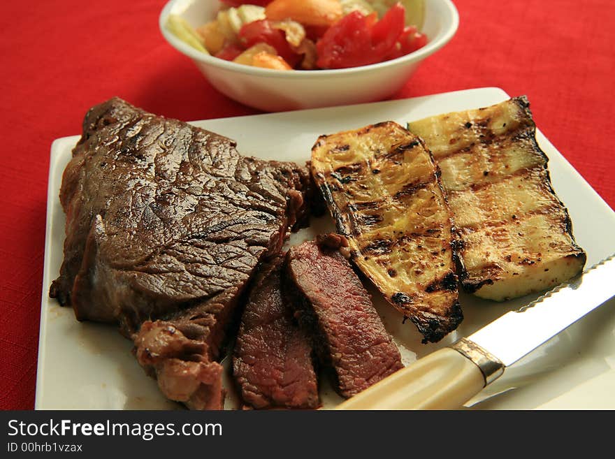 Fresh off the grill , Sirloin and Zucchini Squash with a cucumber and tomato Salad picked from the garden. Fresh off the grill , Sirloin and Zucchini Squash with a cucumber and tomato Salad picked from the garden