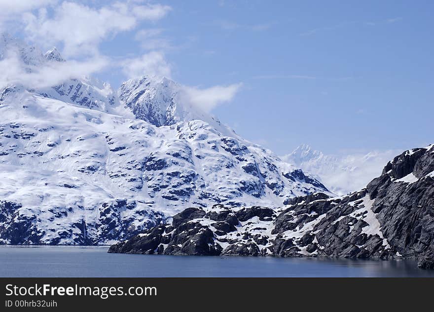 Snow-covered mountain range in Glacier Bay national park, Alaska.