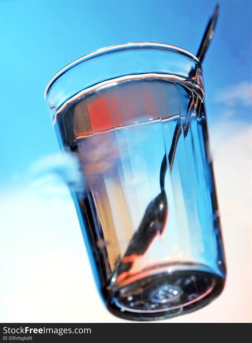 Glass of water on a blue background. Glass of water on a blue background