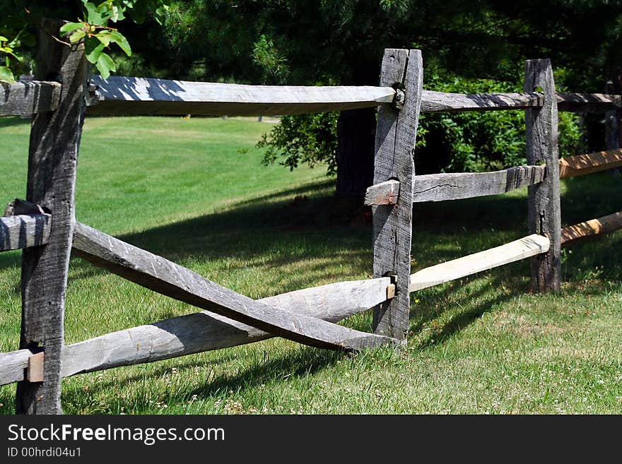 An image of a Broken Wooden Rail Fence