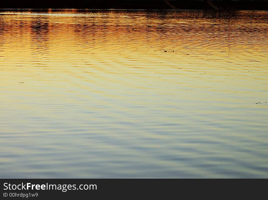 Water Surface At Sunset