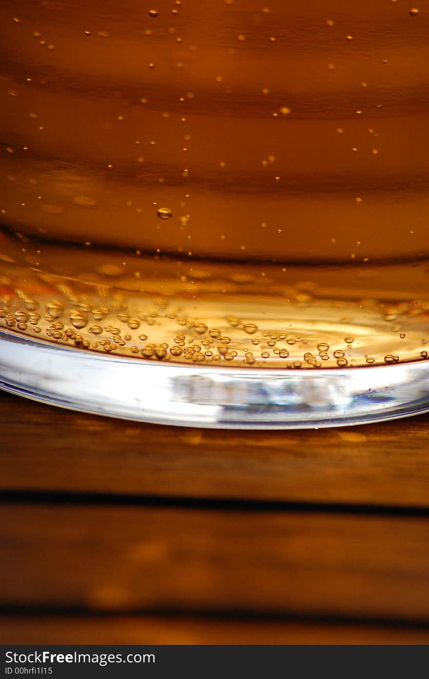 A pint of cider in a glass outside. A pint of cider in a glass outside