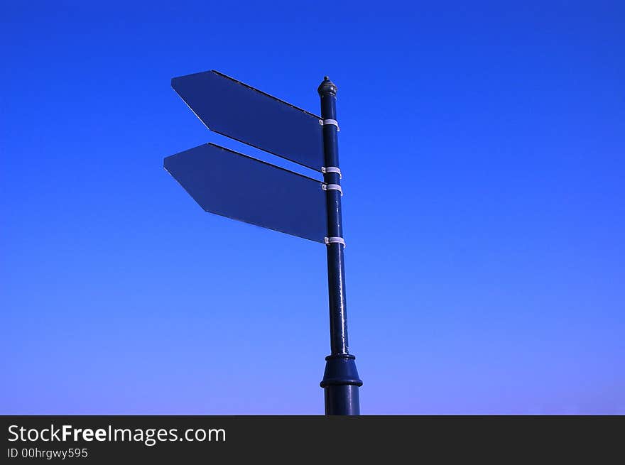 Photo empty sign on the blue sky. Photo empty sign on the blue sky