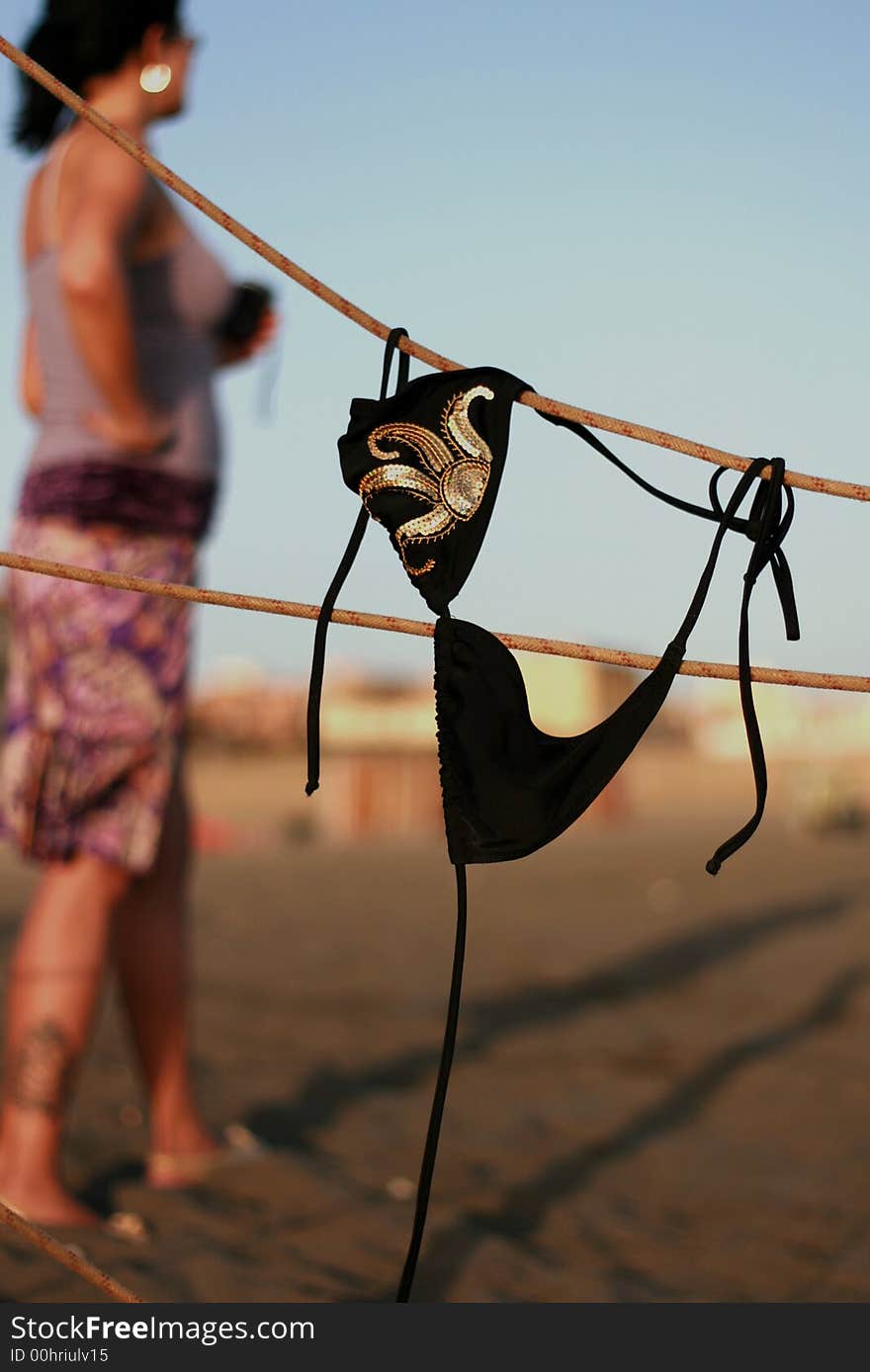 Youn woman is waiting for her bikini to dry. Youn woman is waiting for her bikini to dry