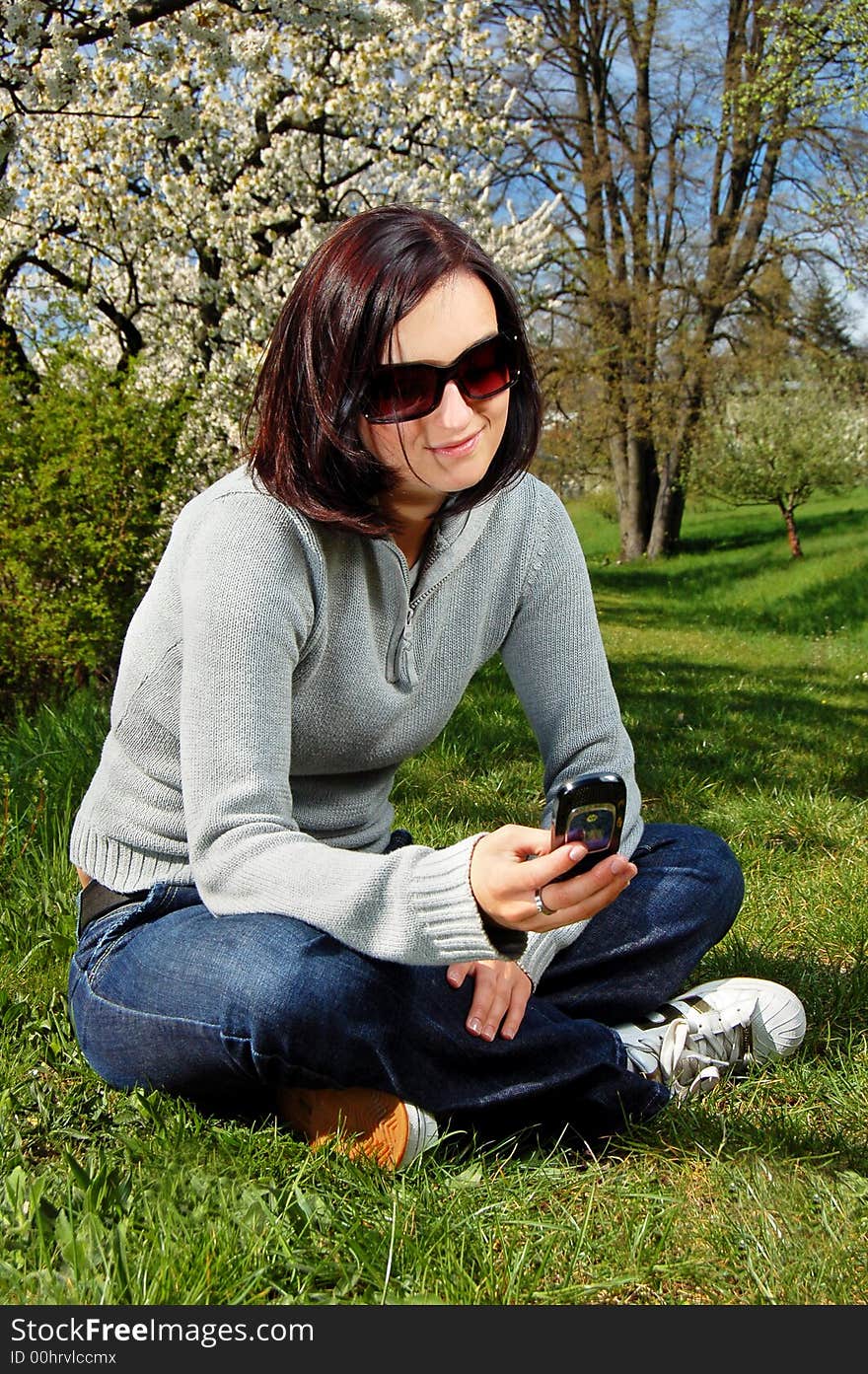 Portrait of a brunette nice girl in a park.