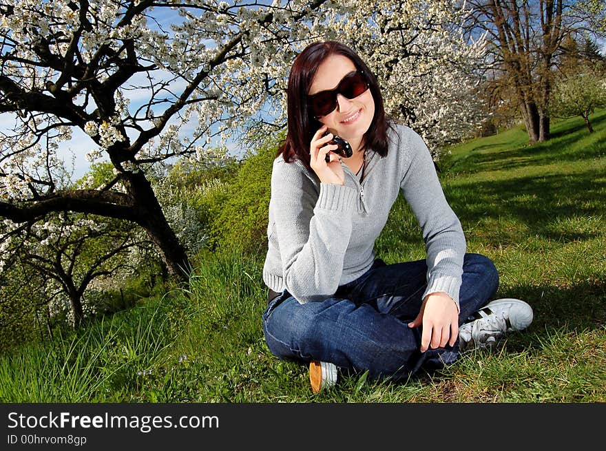 Portrait of a brunette nice girl in a park.