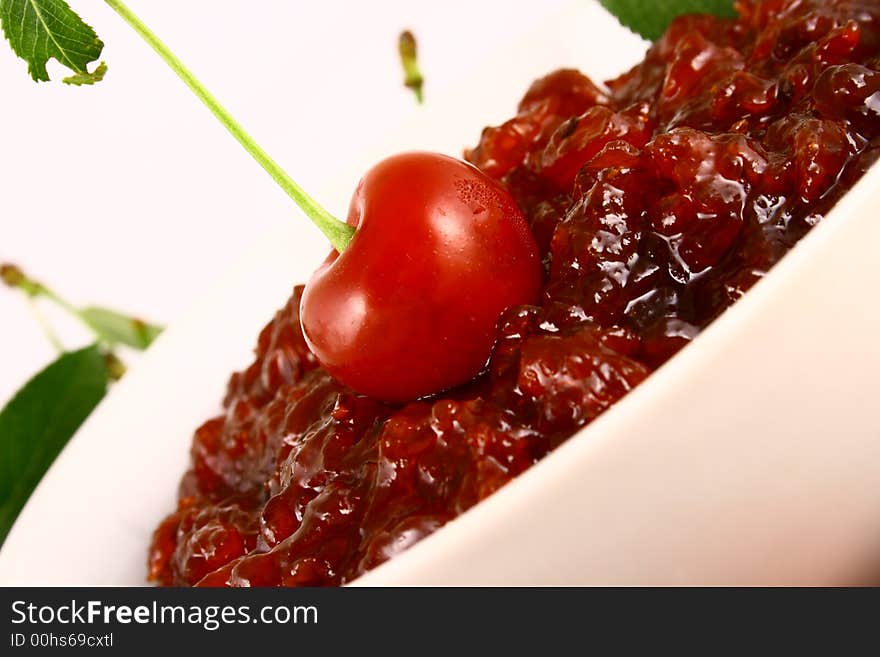 Red cherry jam isolated on white -brown. Red cherry jam isolated on white -brown