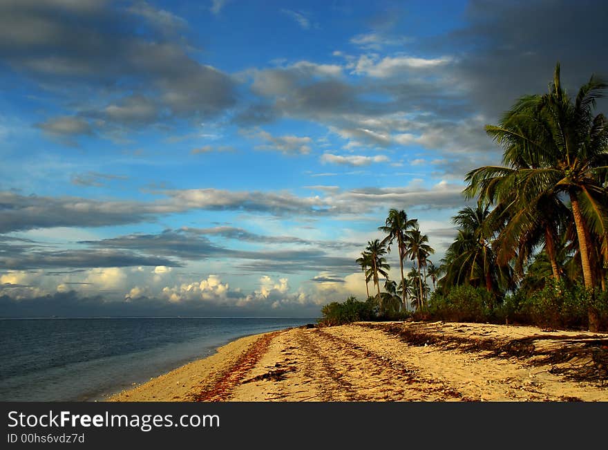 Tropical pristine island beach at sunrise.