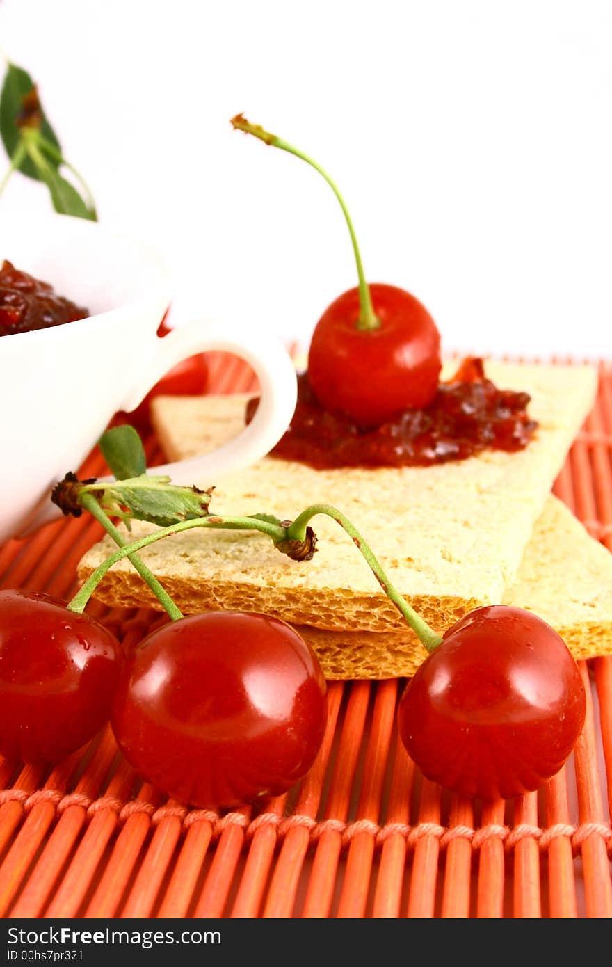 Red cherry jam isolated on white -brown. Red cherry jam isolated on white -brown