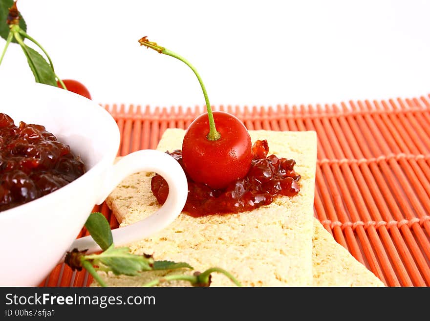 Red cherry jam isolated on white -brown. Red cherry jam isolated on white -brown