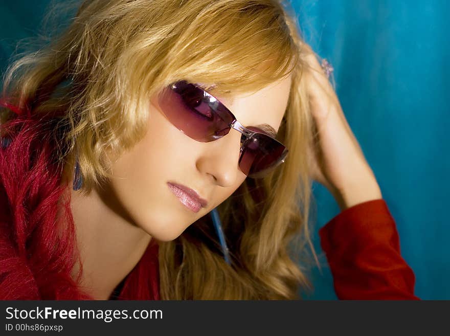 Portrait of young beautiful  blond girl in sun glasses