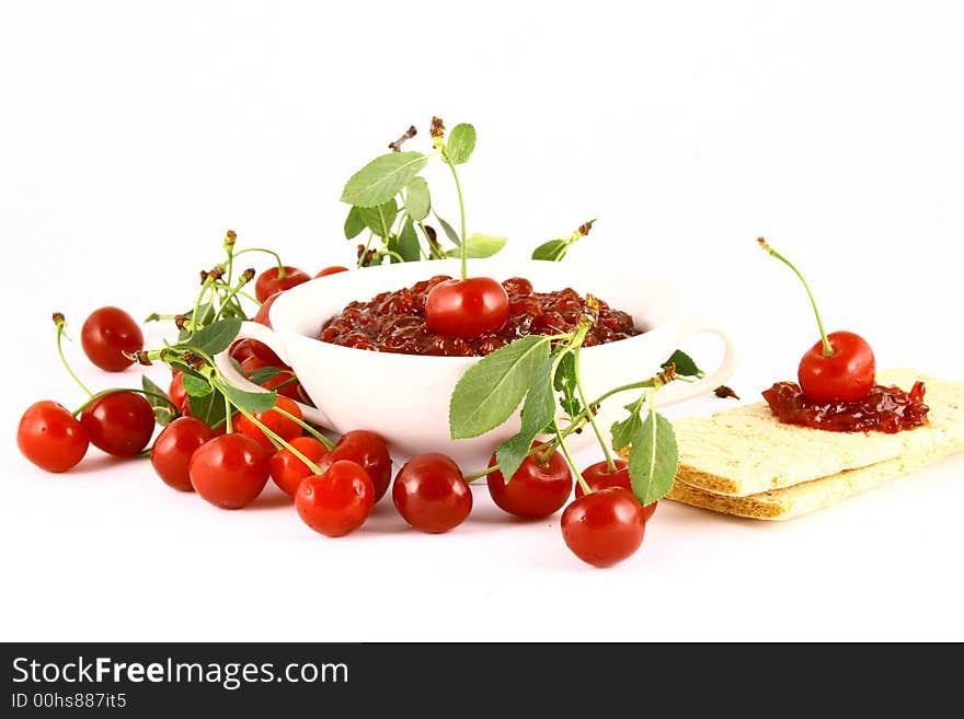 Red cherry jam isolated on white -brown. Red cherry jam isolated on white -brown