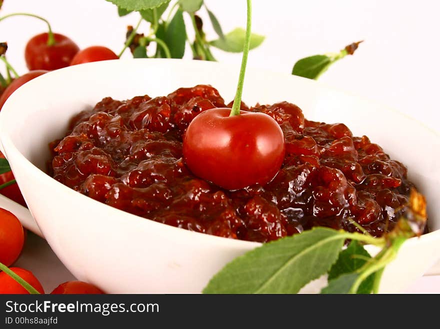 Red cherry jam isolated on white -brown. Red cherry jam isolated on white -brown