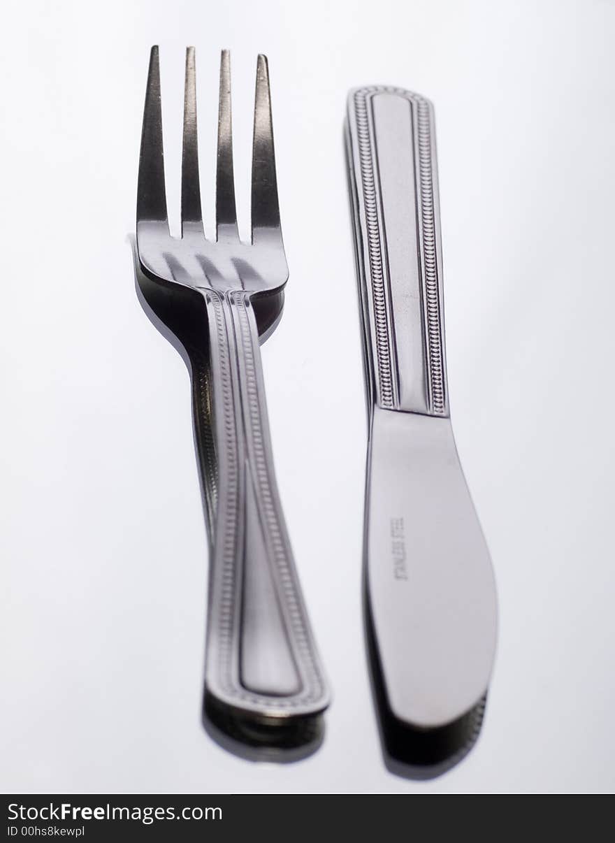 Close up of Knife and fork on white