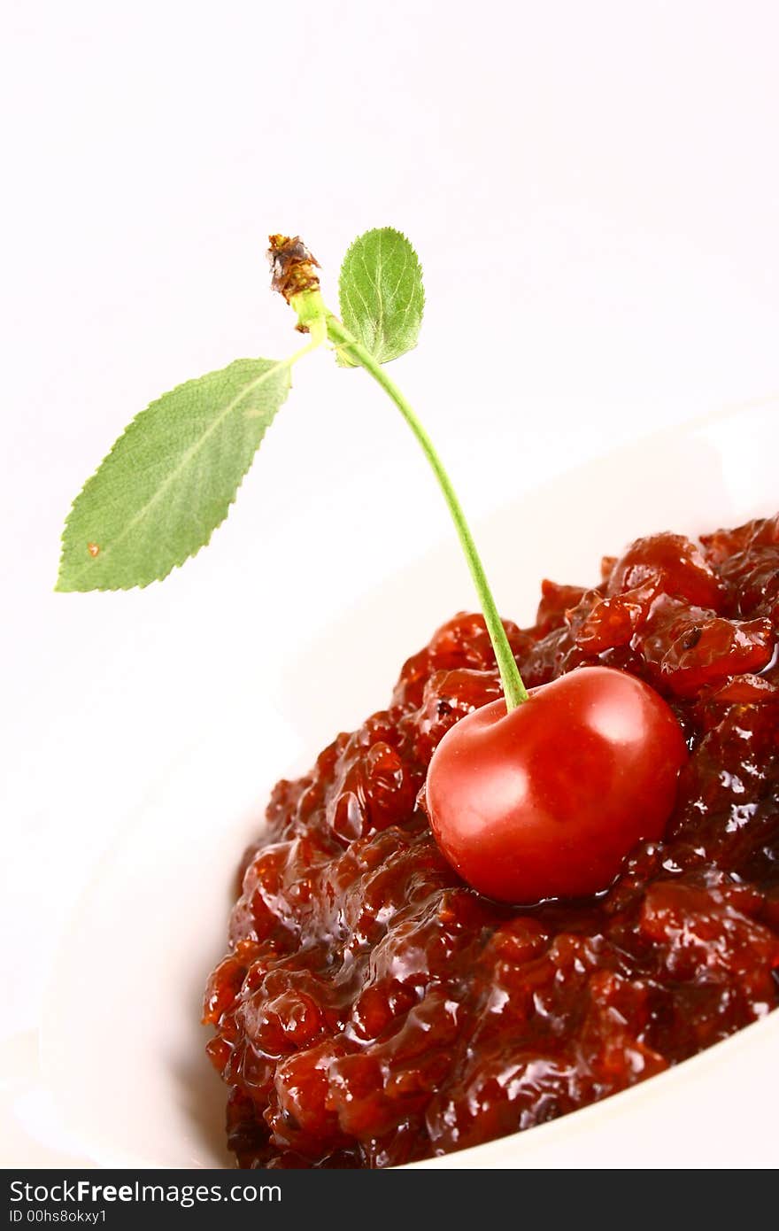 Red cherry jam isolated on white -brown. Red cherry jam isolated on white -brown