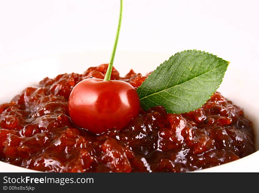 Red cherry jam isolated on white -brown. Red cherry jam isolated on white -brown