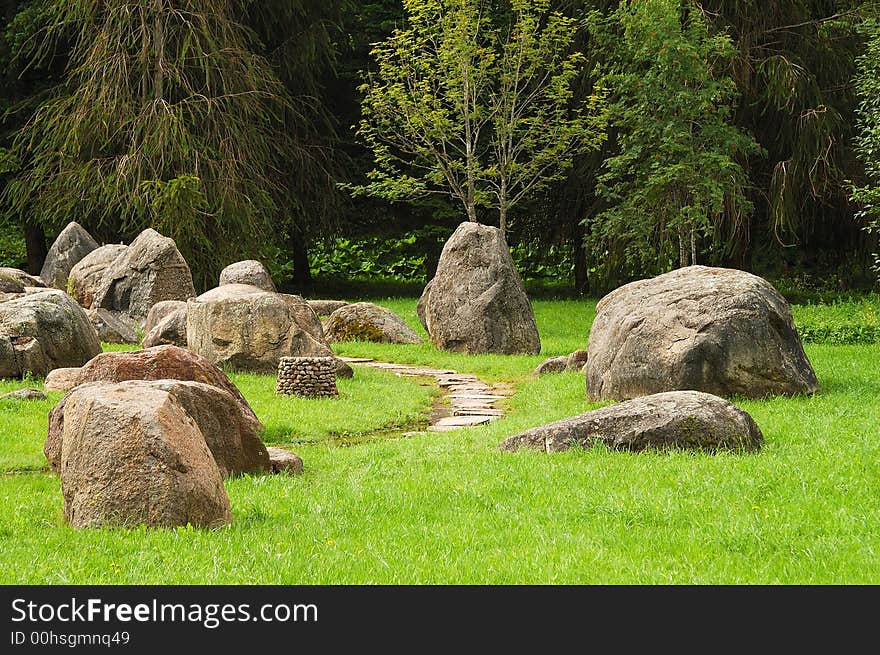 Park with trees and big stones. Park with trees and big stones.