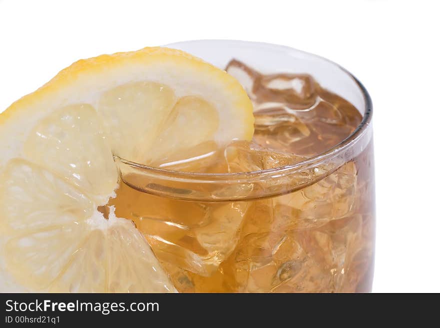 Cold glass of ice tea with lemon slice