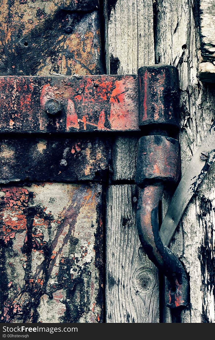 An ancient rusty hinged door