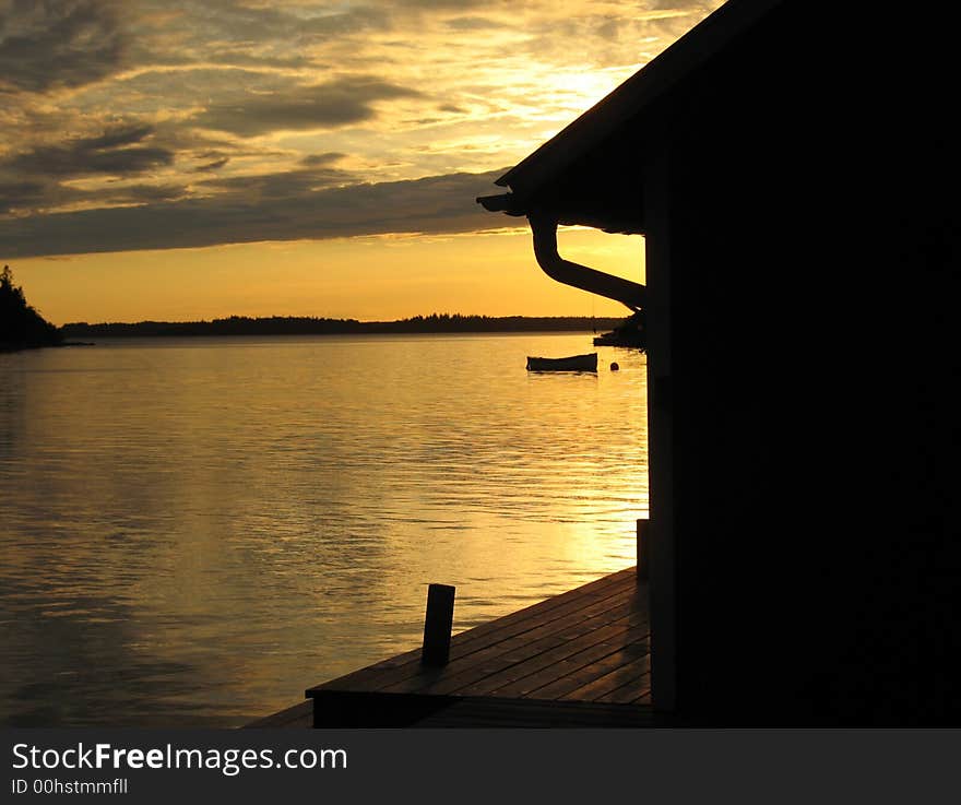 Pier in sunset in the archipelago in Northern Europe. Pier in sunset in the archipelago in Northern Europe