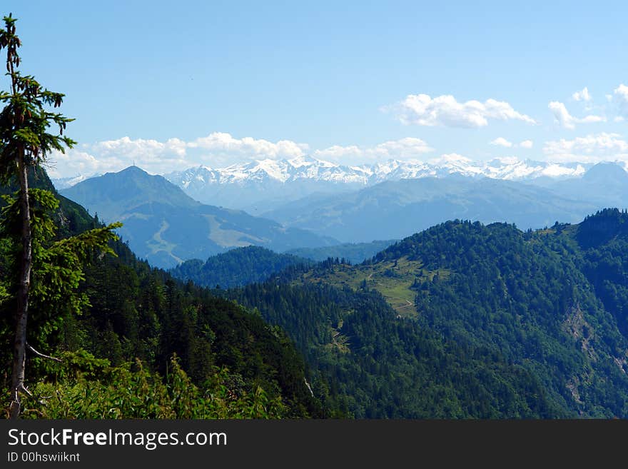 Landscape in Alpes,green Forest  ,Mountains sunshine and small haze
Austria,Kossen, July 2007. Landscape in Alpes,green Forest  ,Mountains sunshine and small haze
Austria,Kossen, July 2007