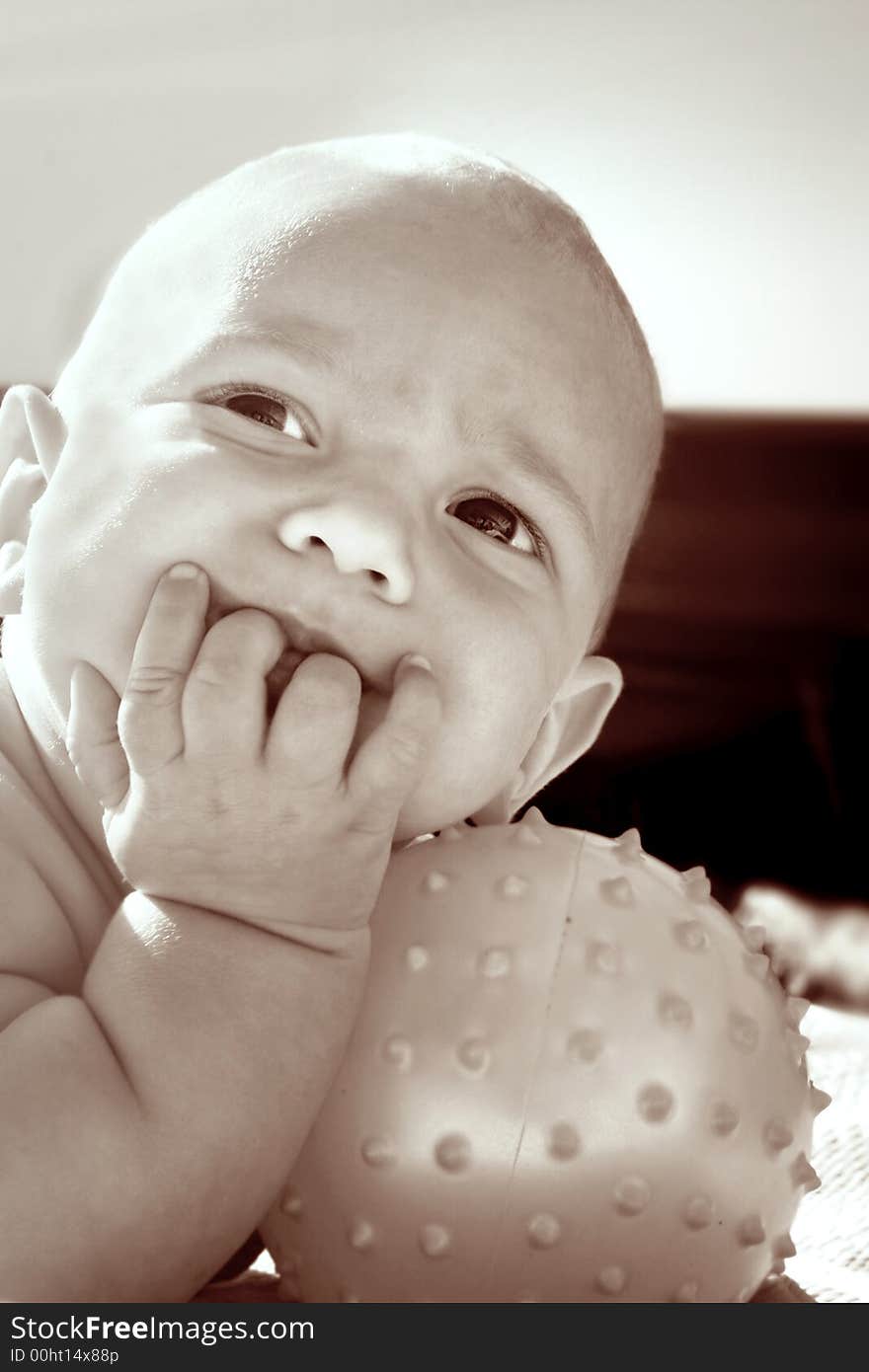 Portrait of a baby with ball