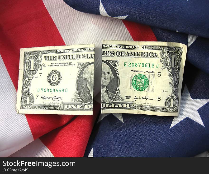 American flag with cash linking patriotism with finiancial interests