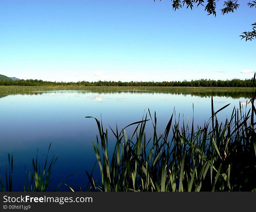 Mountain lake on a background of the sky