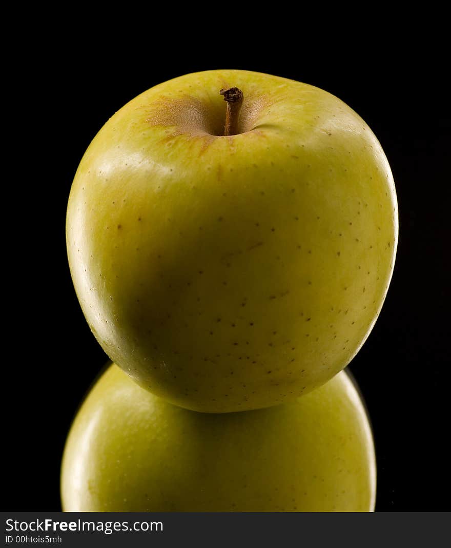 Reflection and Close up of an apple