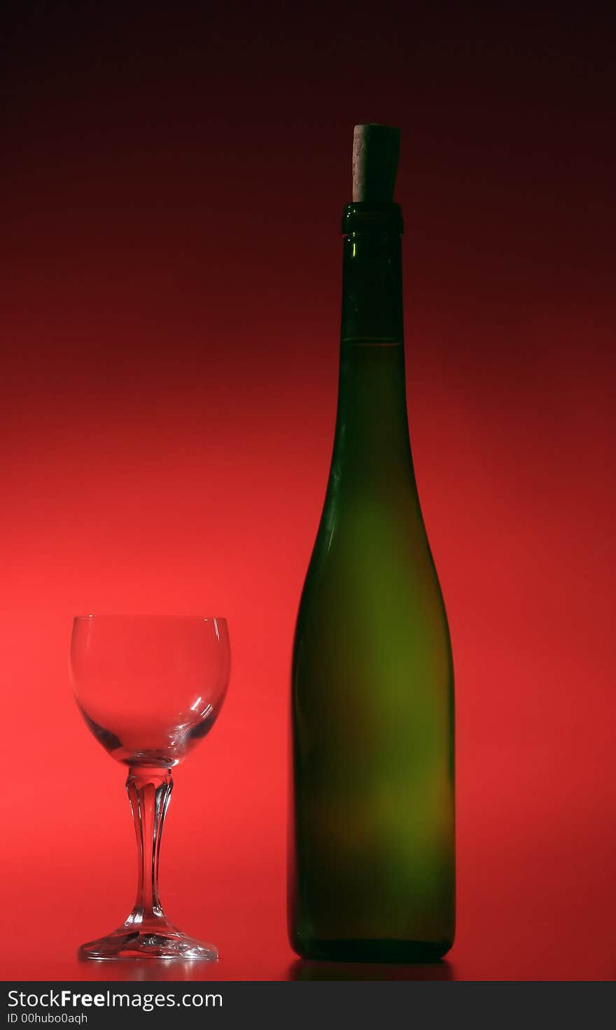 Bottle of white wine on red background. Bottle of white wine on red background