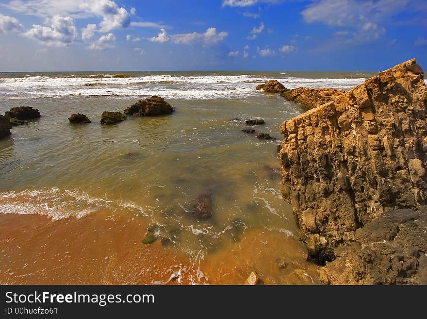 Coast of Mediterranean sea with big stones in water. Coast of Mediterranean sea with big stones in water