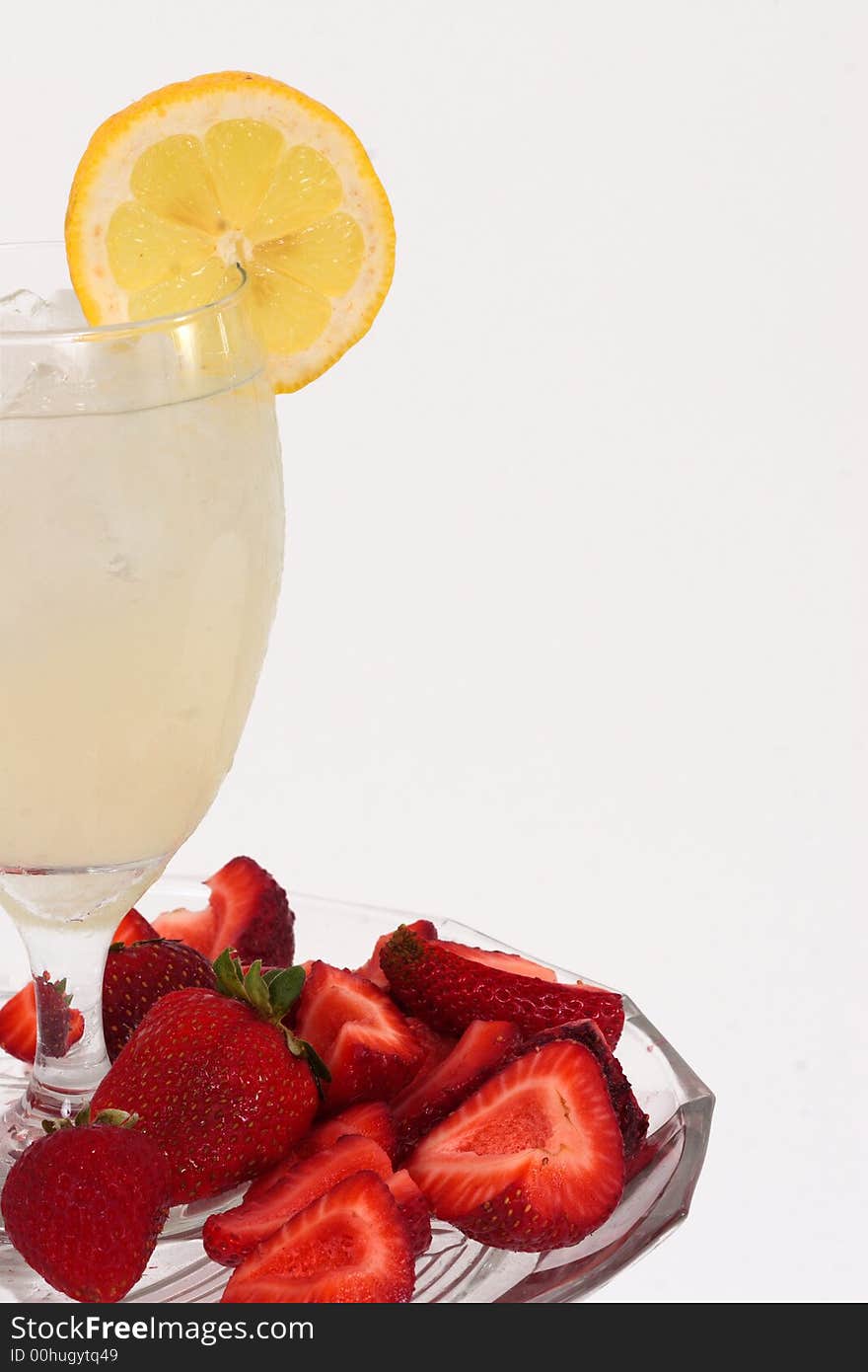 A lemonade drink and strawberries - yum!. A lemonade drink and strawberries - yum!