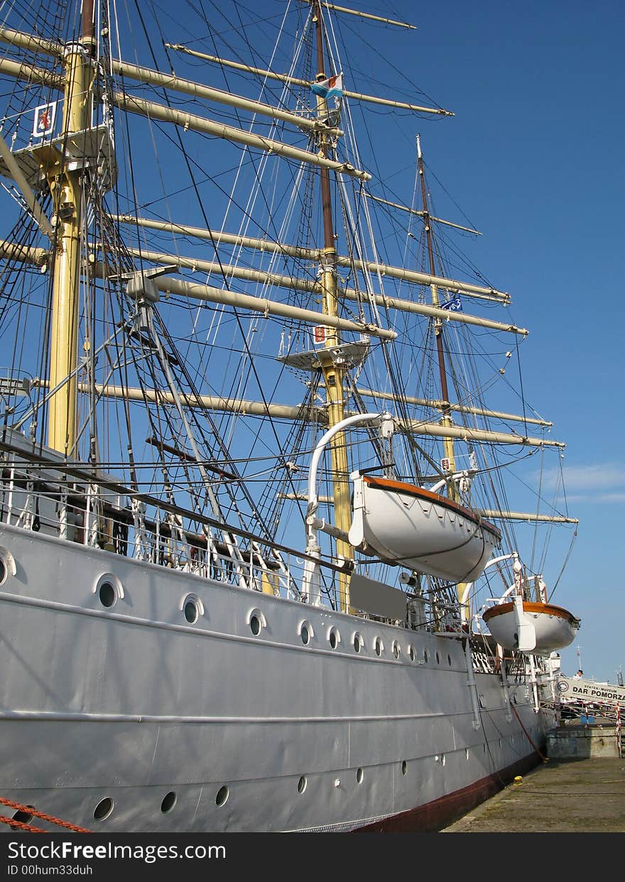 Big and old sailing ship in a harbour of Gdynia, Poland. Big Mast and life boats. Big and old sailing ship in a harbour of Gdynia, Poland. Big Mast and life boats.