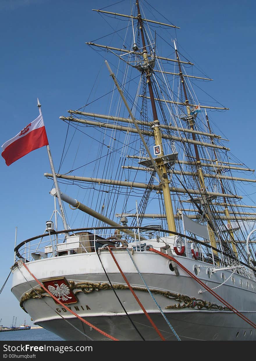 Big and old sailing ship in a harbour of Gdynia, Poland. Stern of a boat. Big and old sailing ship in a harbour of Gdynia, Poland. Stern of a boat.