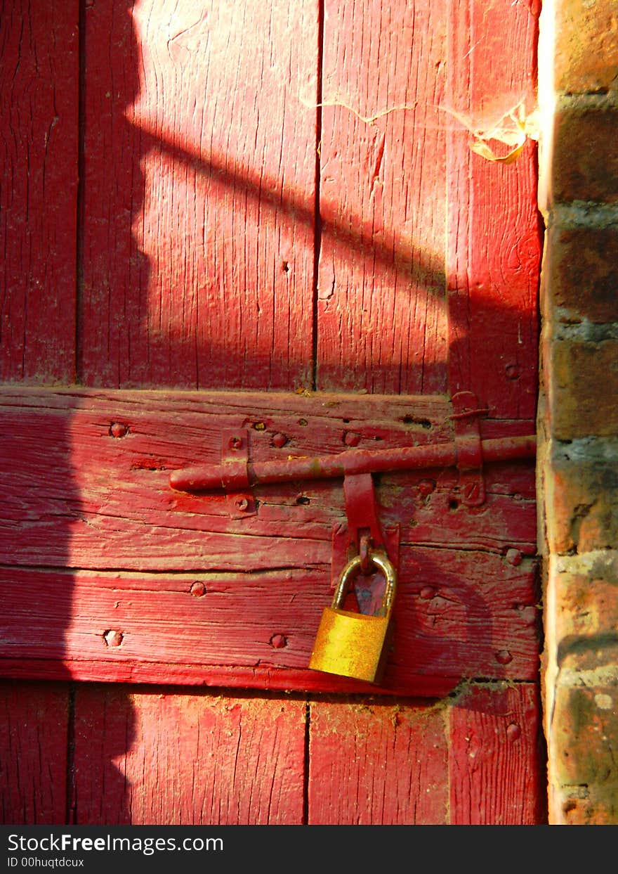 Padlock on an old red door. Padlock on an old red door